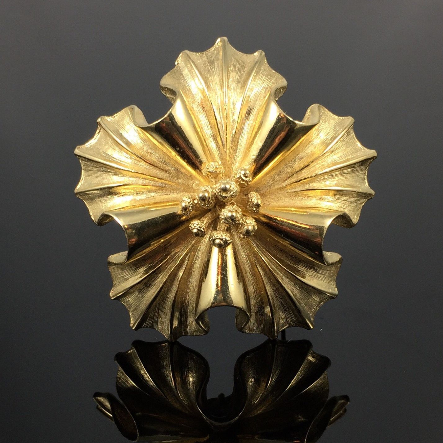 gold flower brooch